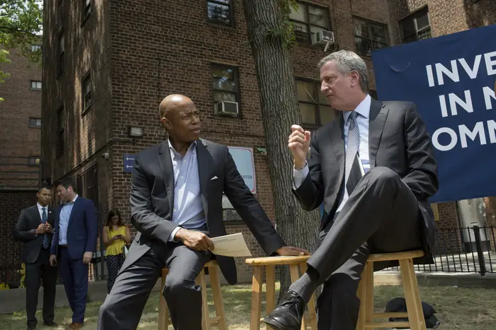 Former New York City mayor Bill de Blasio and then-Brooklyn borough president Eric Adams attend a ceremony for the groundbreaking of a new community center in the Marcy Houses in June 2018 in Brooklyn. Adams ranted against former de Blasio officials for criticizing the current mayor's administration.
